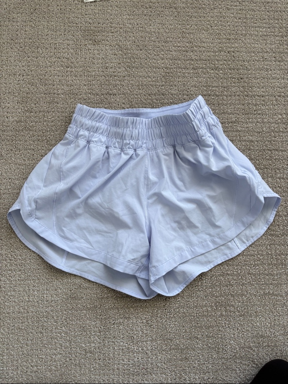 Lululemon track that high waist shorts. Size 6. Light purple.